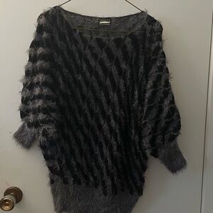 Guilty black and grey fuzzy, striped, dolman-sleeve sweater.